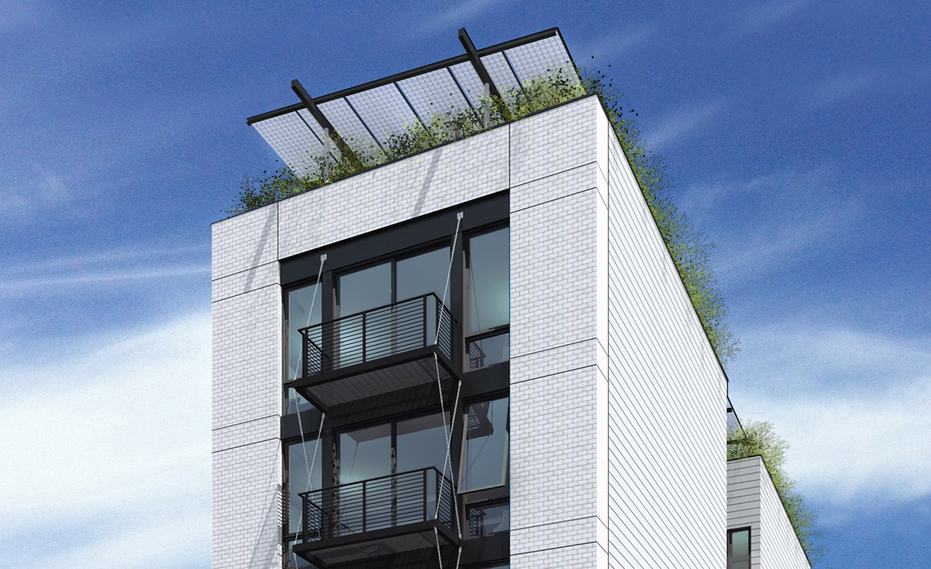 I balconi in acciaio progettati per minimizzare i ponti termici e l'impianto fotovoltaico a tettoia integrato nell'achitettura
